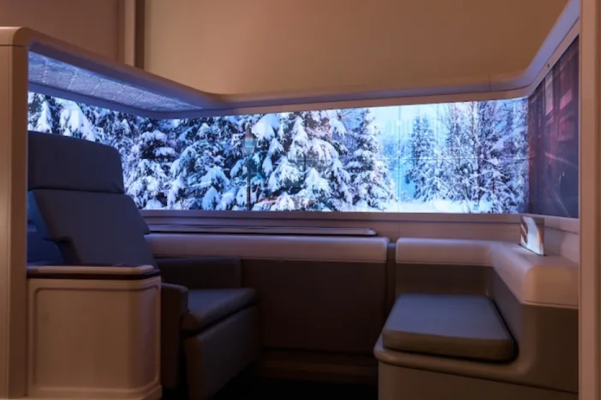 Safran and RAVE Aerospace Origin concept cabin with a snowy forest displayed on the virtual window.