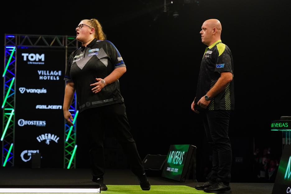 Beau Greaves reacting during her darts match against Michael van Gerwen.