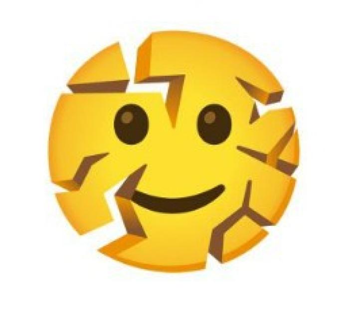 Illustration of a yellow emoji with a smiling face, breaking into many irregular pieces.