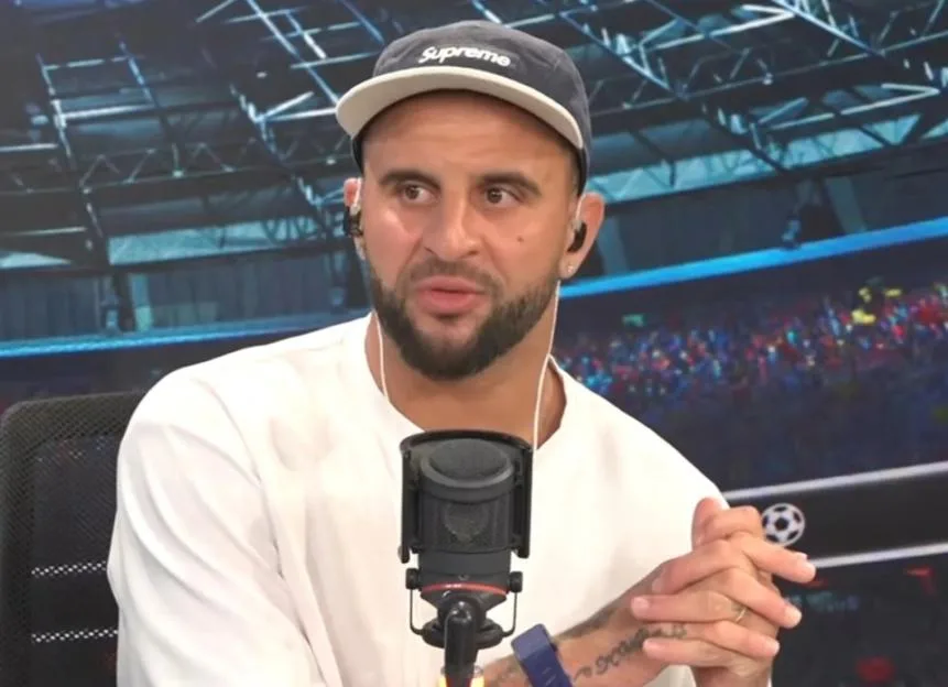 Kyle Walker on TalkSport speaking into a microphone.