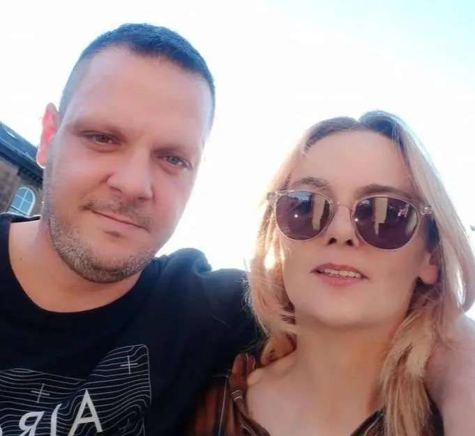 James and a woman outdoors.