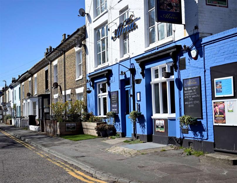 Pensioner ordered to repaint lovely blue home after one neighbour complains