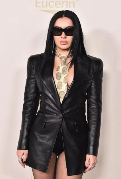 British singer Charli XCX wearing a black leather blazer and sunglasses at the 3rd Annual InStyle Imagemaker Awards.