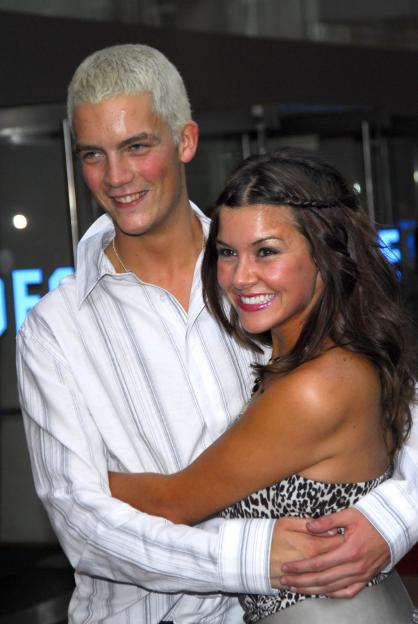 Glyn Wise and Imogen Thomas smiling and embracing at the "You, Me & Dupree" London Premiere.