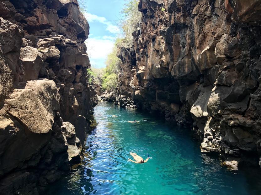 Woman swimming in a natural pool, Galapagos Islands