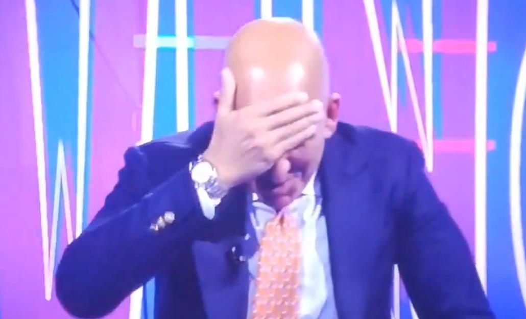 Paolo Di Canio covering his face with his hand.