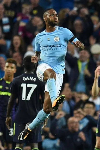 Manchester City's Raheem Sterling celebrates scoring a goal against Everton.