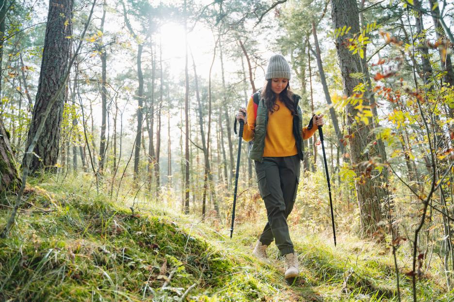 Older couple walking outdoors together on path in mountains. Copyright: Getty Images - Getty