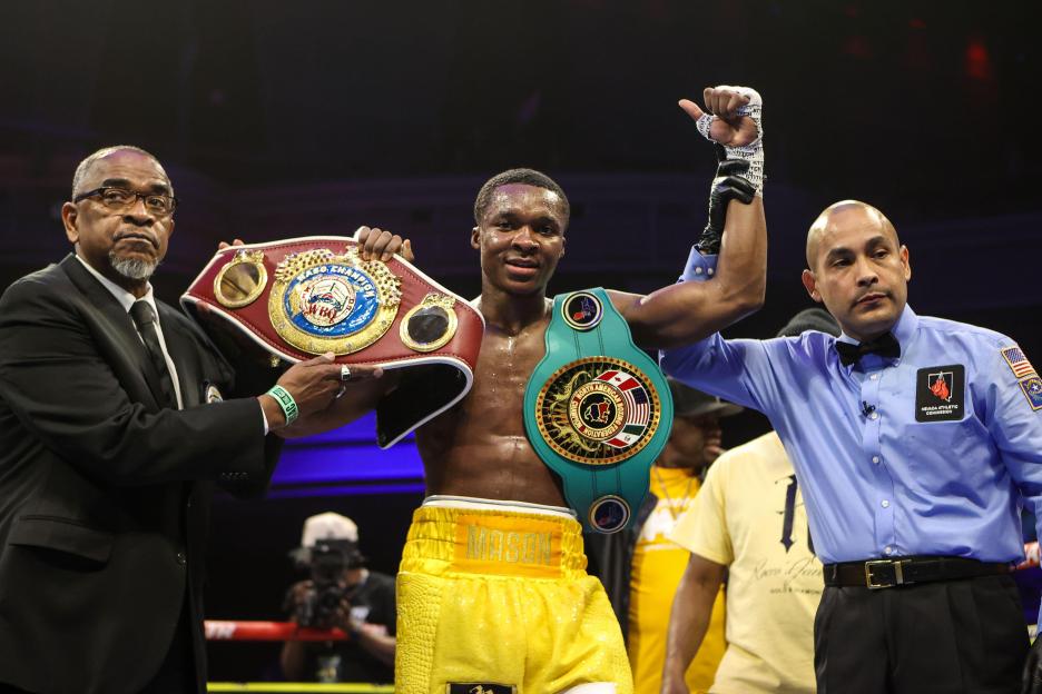 Abdullah Mason with the NABF and NABO lightweight titles.