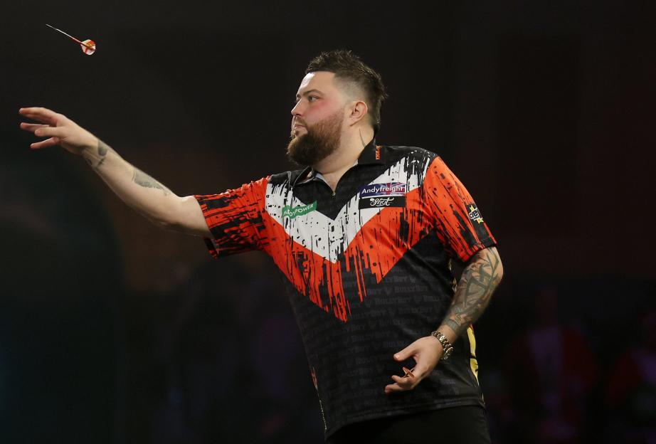 Michael Smith throwing a dart during the Paddy Power World Darts Championship.