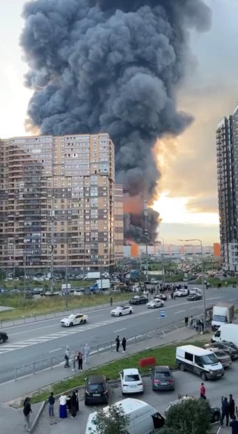 People gaze at huge fire at Wildberries facility, in St.Petersburg