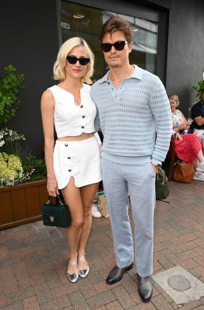 Pixie Lott and Oliver Cheshire posing for a photo.