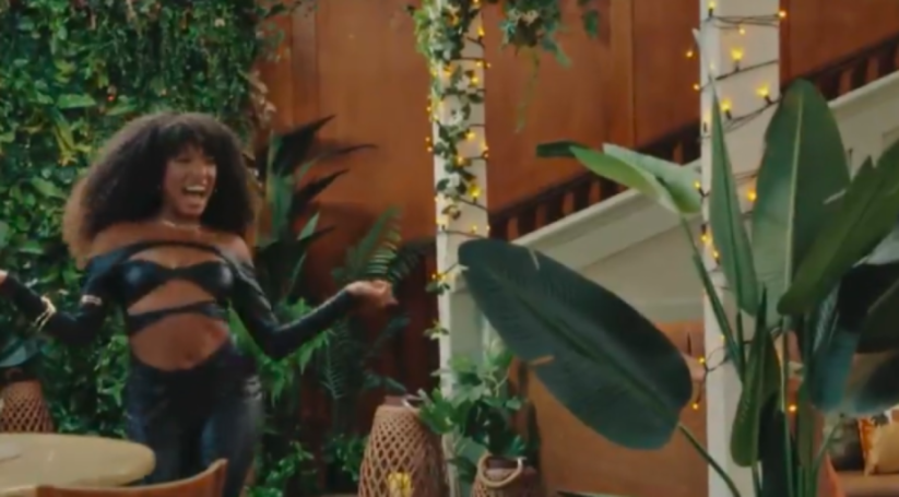 Julia-Ruth in a black cut-out outfit.