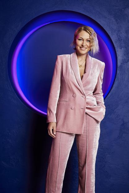 Emma Willis in a pink velvet suit.