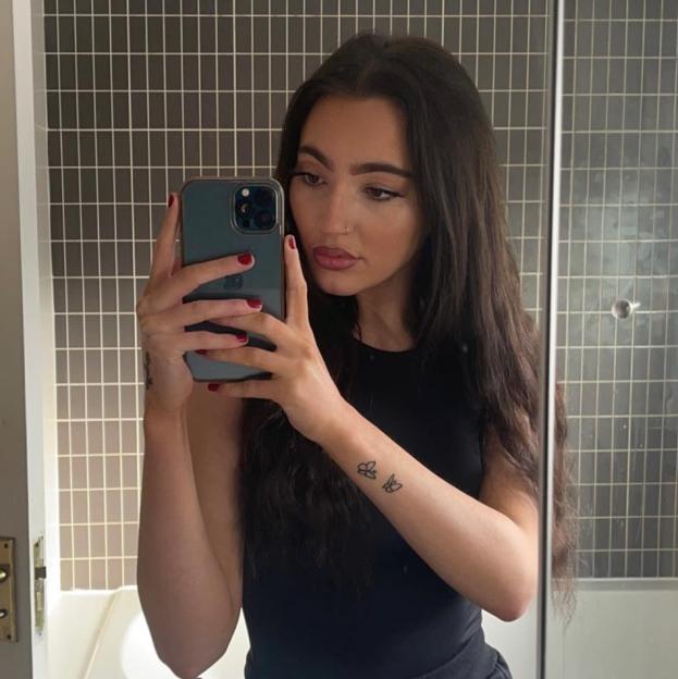 Jess Waterman taking a selfie in a mirror.