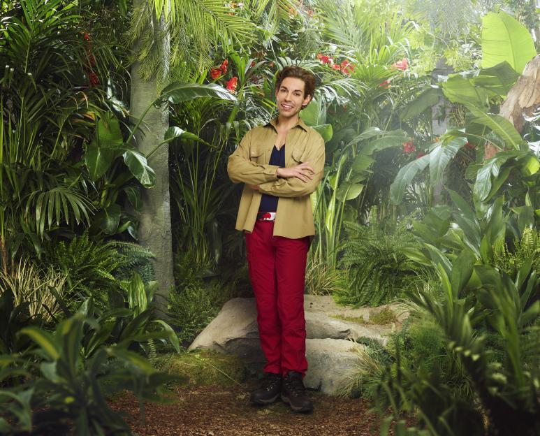 Tom Read Wilson smiling in a jungle setting.