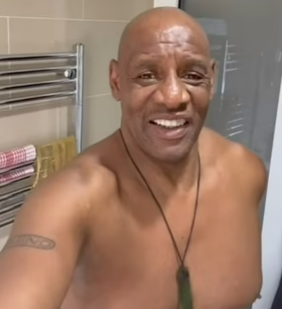Shaun Wallace from The Chase showing off his weight loss shirtless in a bathroom.