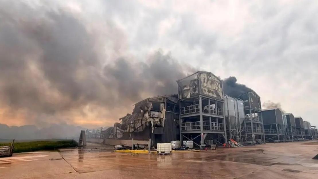 A fire at a chicken farm in Cheshire, showing huge plumes of smoke coming from a damaged building.