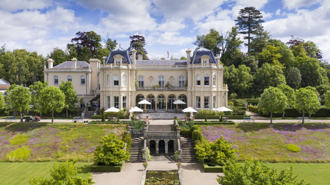 Beaverbrook Hotel with terraced gardens and a pond.