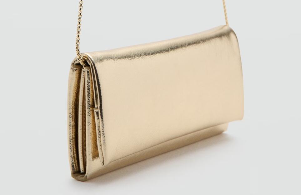 Gold clutch bag with a chain strap.