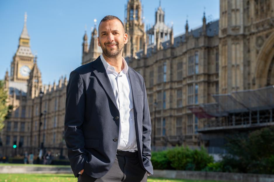 Zack Polanski, the Green Party's new leader, poses for a portrait outside the Houses of Parliament in London.