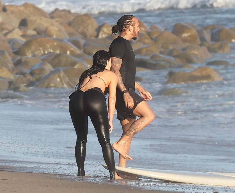 Lewis Hamilton and Kim Kardashian on the beach.