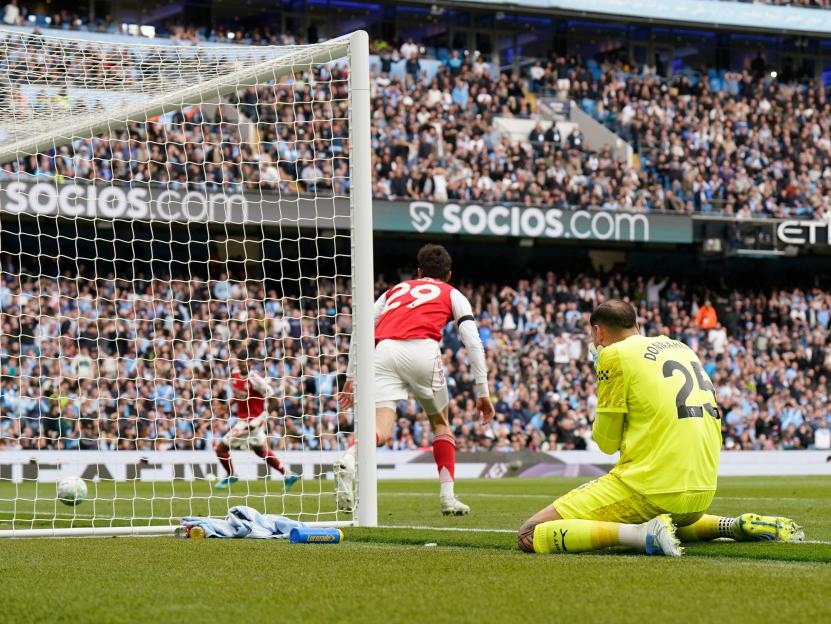 Manchester, UK. 19th Apr, 2026. Kai Havertz of Arsenal turns away to celebrate after intercepting a kick by Gianluigi Donnarumma of Manchester City to equalise during the Manchester City vs Arsenal Premier League match at the Etihad Stadium, Manchest
