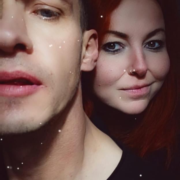 A close-up of Rebecca Williams' and Michael Burns' faces.