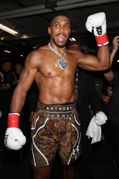 Anthony Joshua celebrates victory over Jake Paul after their heavyweight bout.