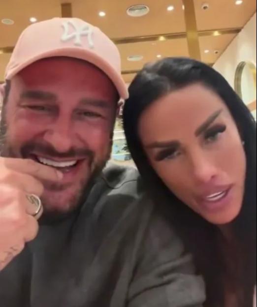 Carl Woods and Katie Price smiling.