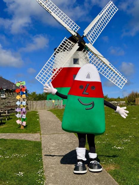 Windmill row erupts as owner ordered to repaint it after colourful makeover