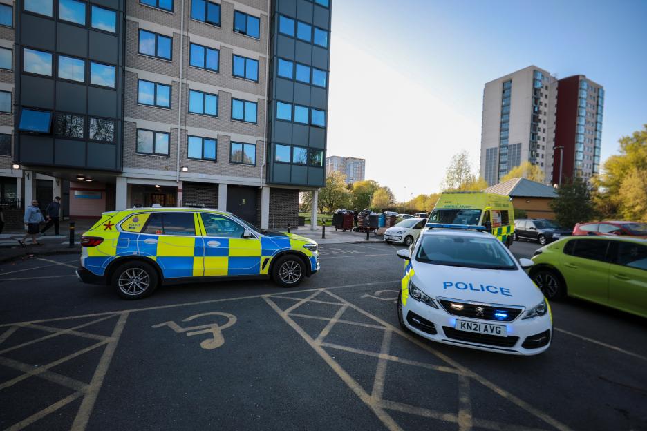 Police Response Intensifies at Tower Block After Woman's Death; Man Arrested on Murder Charges
