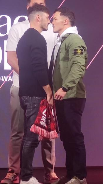 'Intense Face-Off: Security Steps In as Leigh Wood and Josh Warrington Clash'