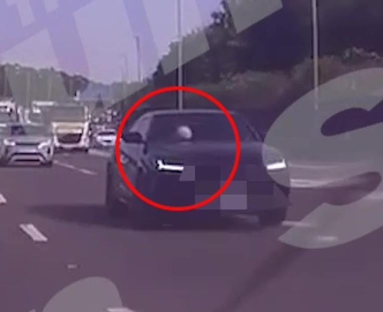 Moment Raheem Sterling is seen inhaling laughing gas while driving £270k Lambo on motorway just minutes before crash