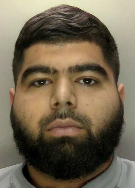 Mohammed Suffi, a man with a thick beard and dark hair, looks directly into the camera.