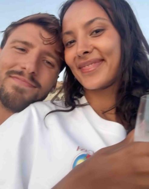 Maya Jama and Ruben Dias smiling in a selfie.