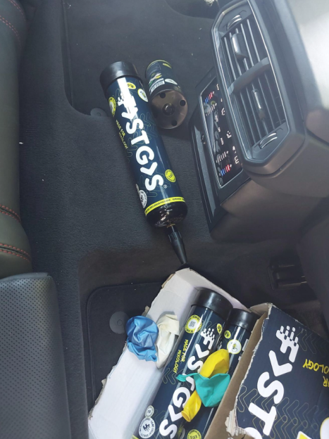 Nitrous oxide canisters and balloons in a vehicle.