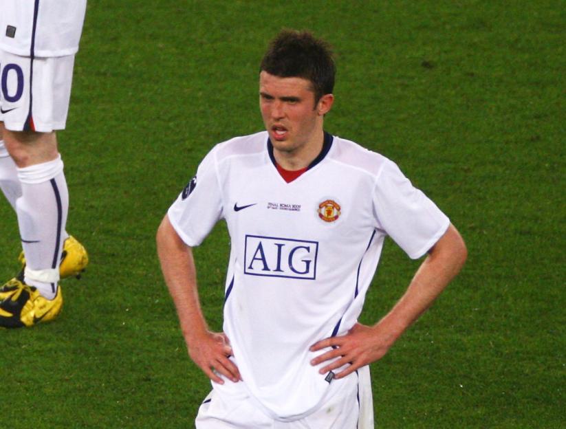 Wayne Rooney and Michael Carrick of Manchester United look dejected after Lionel Messi scored a goal for Barcelona during the UEFA Champions League Final.