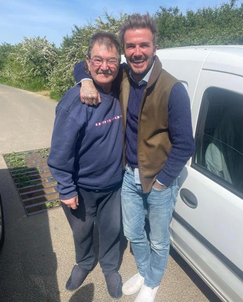 Gerald from Clarkson's Farm and David Beckham smiling with arms around each other.