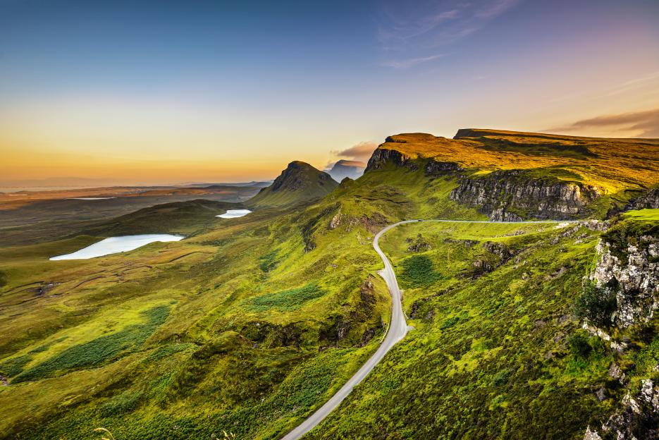 Sunset over the Quiraing mountains at Isle of Skye, Scottish Highlands.