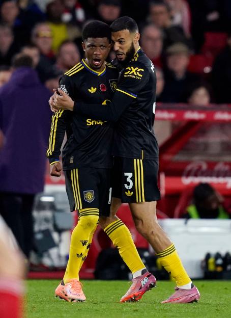 Nottingham, England, 1st November 2025. Amad Diallo of Manchester United (L) celebrates after scoring the second goal with Noussair Mazraoui of Manchester United during the Nottingham Forest vs Manchester United Premier League match at the City Ground