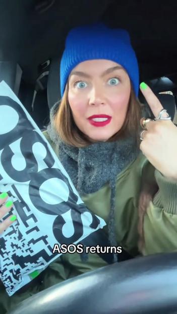 A woman in a car with wide eyes and red lipstick holds an ASOS return package.