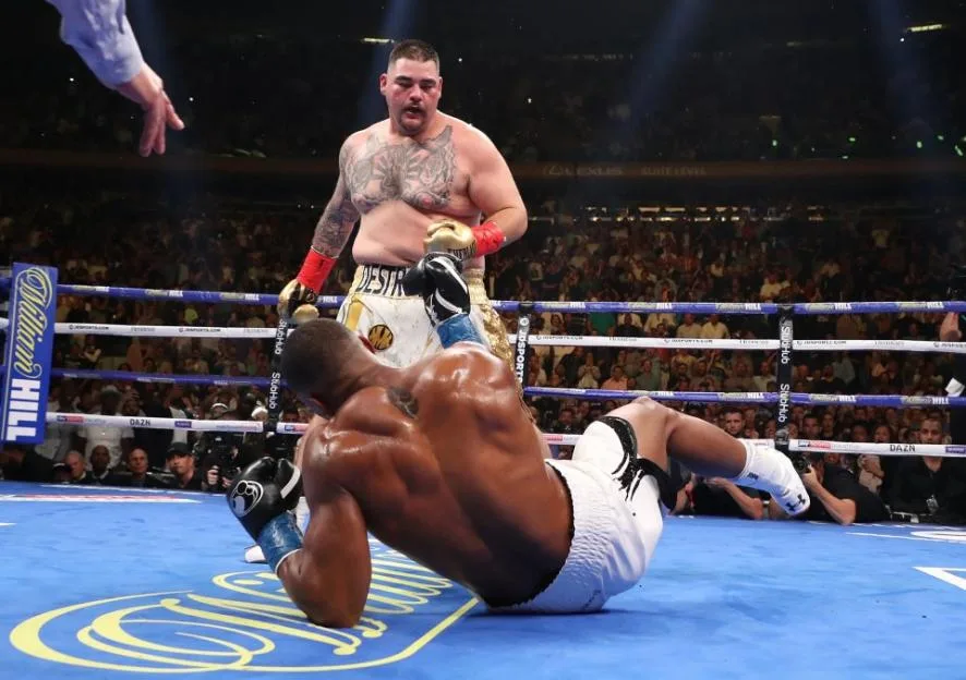Andy Ruiz Jr. stands over a fallen Anthony Joshua after knocking him down during their heavyweight title fight.