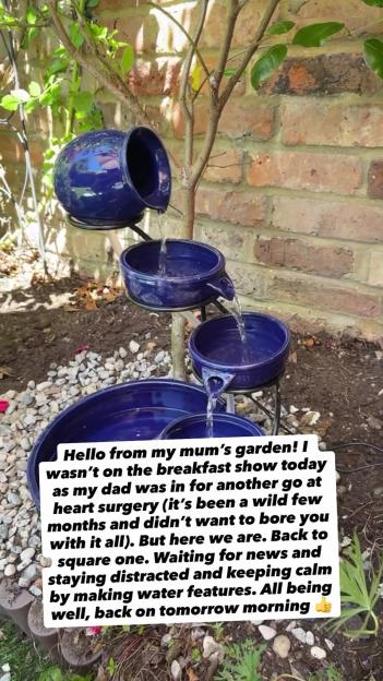 A cascading water feature in a garden, made from blue ceramic bowls.
