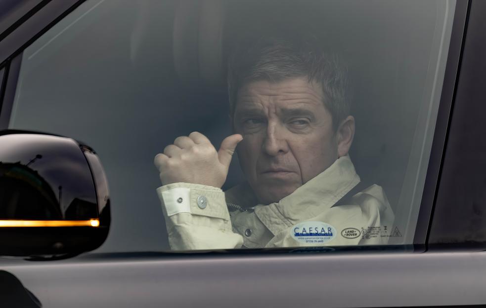 Liam Gallagher in a chauffeur-driven car.