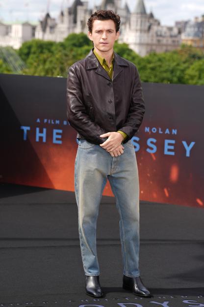 Tom Holland poses for photographers at the photo call for "The Odyssey."