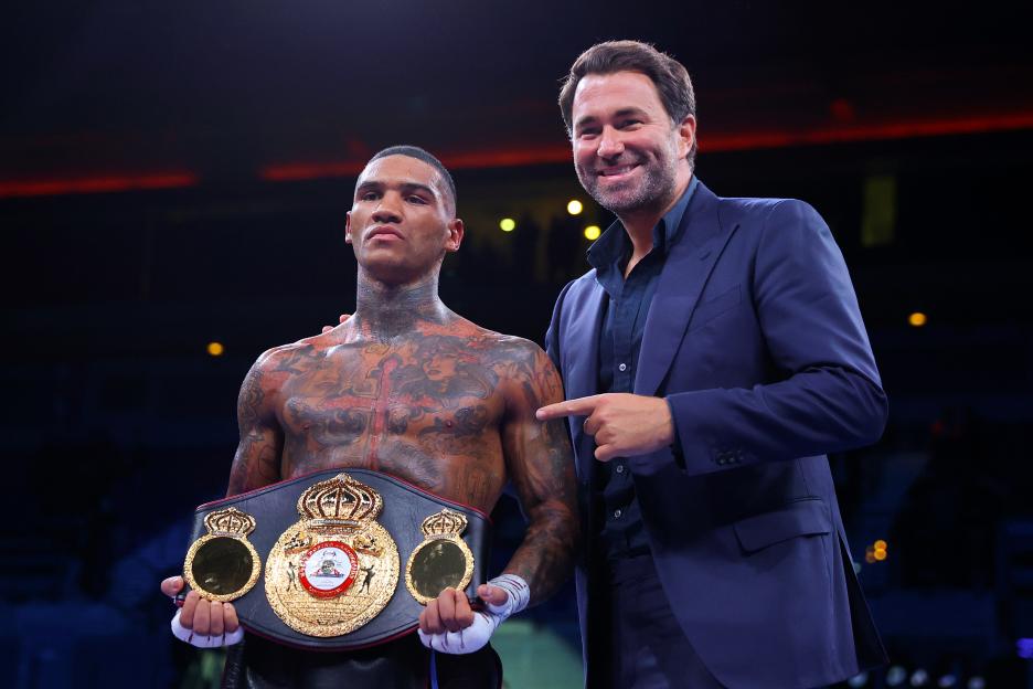 Conor Benn poses with his WBA Continental Welterweight Title belt alongside boxing promoter Eddie Hearn.
