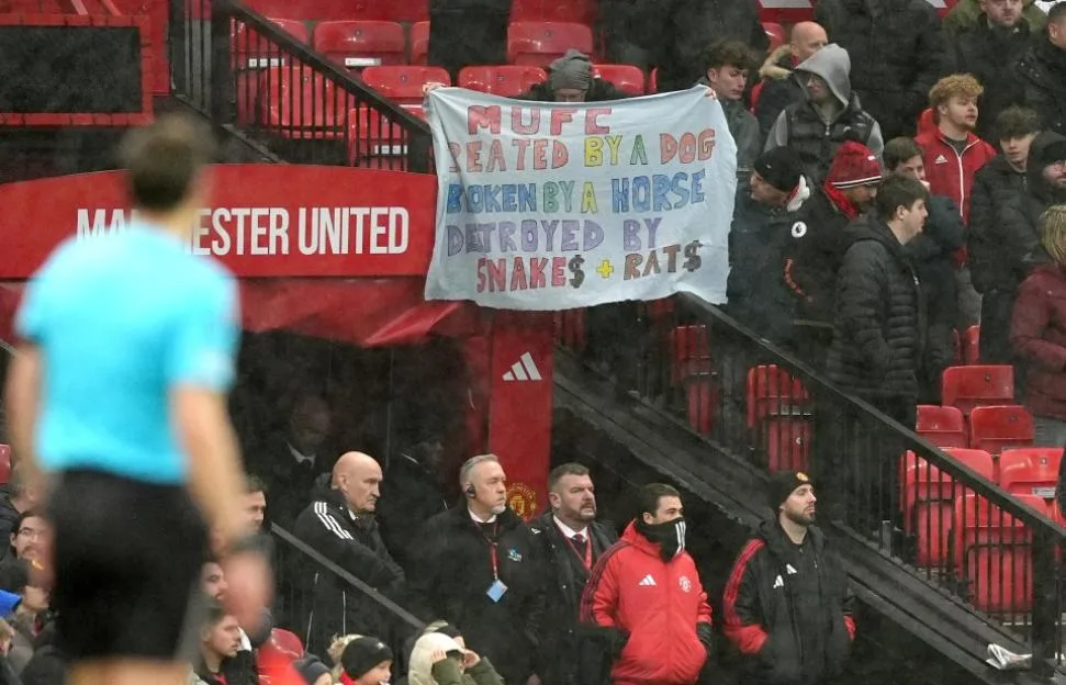 Manchester United fans hold a protest banner against club owners at Old Trafford.