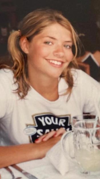 Holly Willoughby smiling and wearing pigtails and a white t-shirt.
