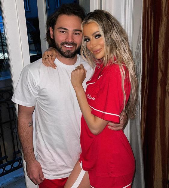 Olivia Attwood and her husband Bradley Dack posing together.